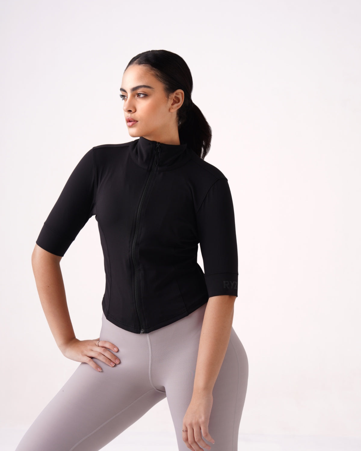 RYZ Original Enhance Elbow-Sleeve Jacket in black, a structured jacket built to move from a work meeting into a training session without a change of clothes