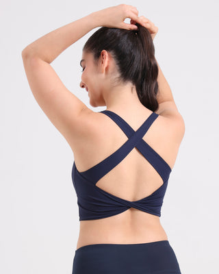 Woman wearing RYZ Original Core padded Knot-Blot crop top in navy, back view