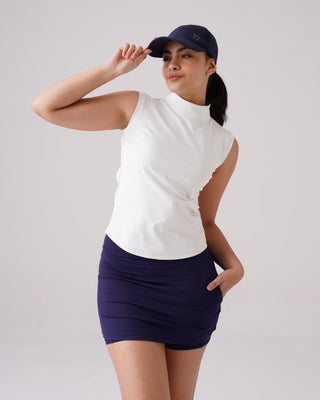 Woman wearing RYZ Core high-neck tank in white, front view