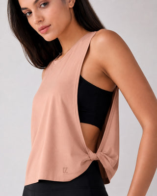Woman wearing RYZ Original Core Layer Tank in blush pink, front view
