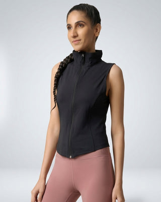 Woman wearing RYZ Original Core sleeveless zip jacket in black, front view